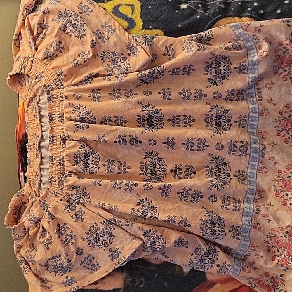 Peach blouse with different designd
